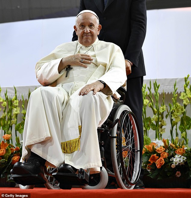 Pope Francis attends a mass at the Hun Theater in a wheelchair on September 3