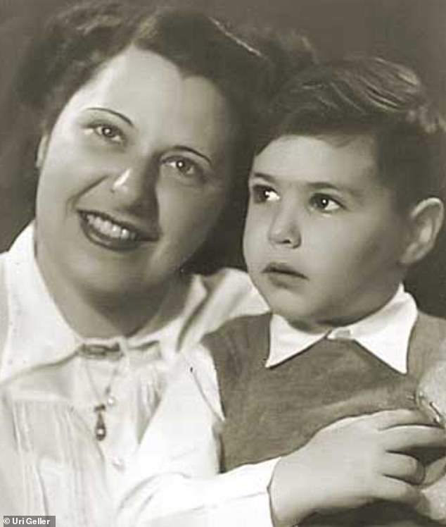 Uri believes his encounter has given him psychic powers, including the ability to read his mother's mind.  Pictured with his mother as a child