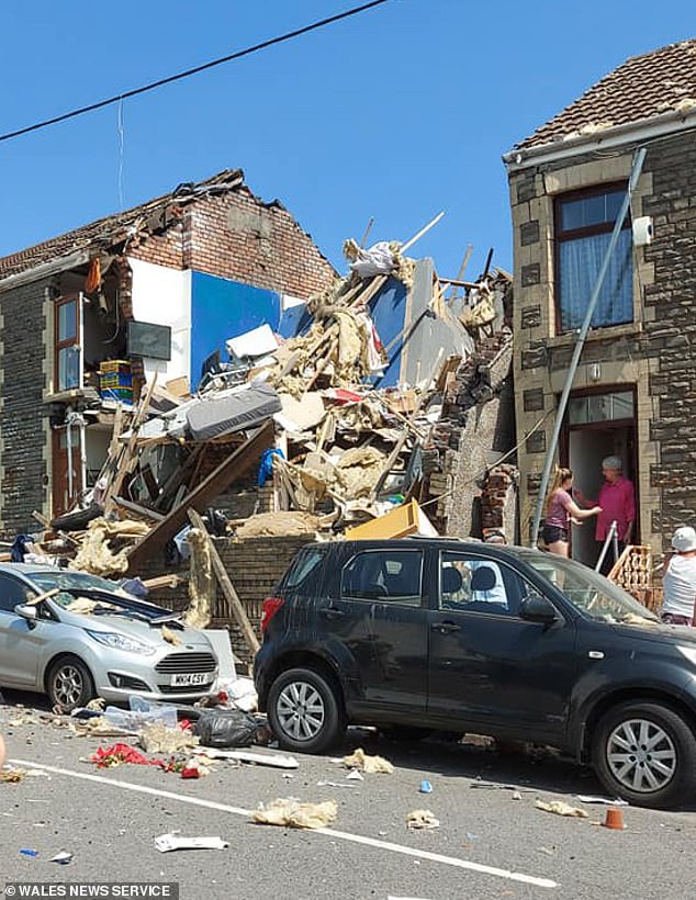 The family's home on the day of the explosion in June 2020, which completely destroyed the building and injured the mother and two sons