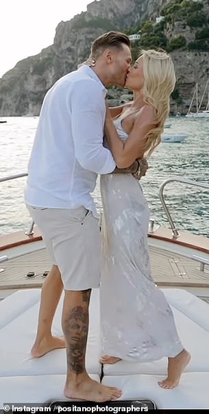 Romantic: The reality star, 31, got down on one knee and popped the question while on a lavish private yacht in Italy, with the picturesque Amalfi Coast in the background