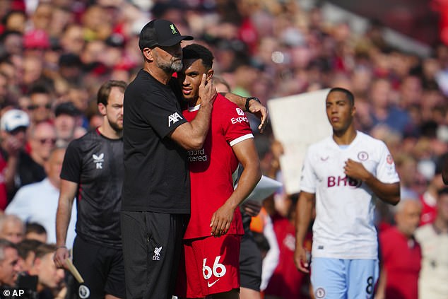 Alexander-Arnold gets a hug from his manager Jurgen Klopp after he was sent off on Sunday