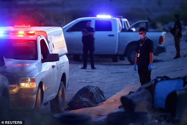 Forensic personnel work at the crime scene where unknown assailants left the bodies of three dismembered people in a vacant lot in Ciudad Juárez, Mexico, on Aug. 31.  Ciudad Juárez, located on the border of northern Mexico, opposite El Paso, Texas, ranks ninth in 2022 with 67.7 homicides per 100 residents