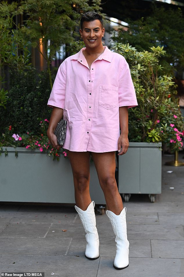 Summer mood: Junaid looked fabulous in a pink shirt dress and white cowboy boots