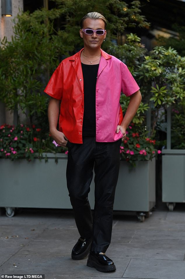 Pose: Harry Derbidge got into the summer mood with a red and pink split shirt