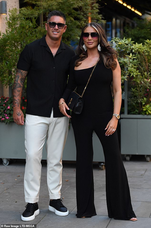 In Love: Amy Childs and her boyfriend Billie Debosk put on a love-making display outside the party