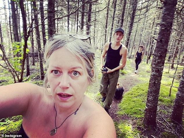 Hynes White is back home in Canada.  His mom Sherry White posted this photo of them both walking in the Newfoundland woods on Aug. 20