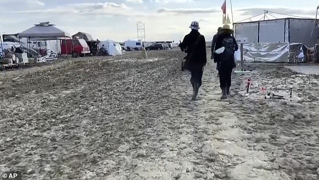 People can be seen wading through mud in Nevada on Monday