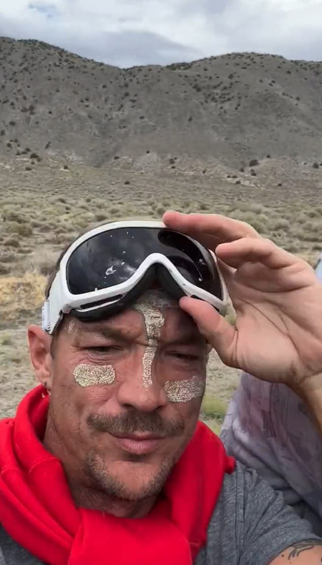 Diplo had ski goggles to shield his eyes from the desert dust as he left the site