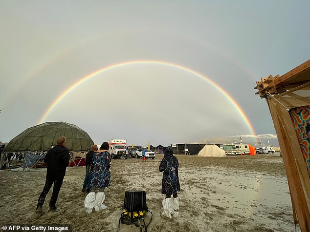 On Friday, during heavy rainfall, a double rainbow can be seen above the site