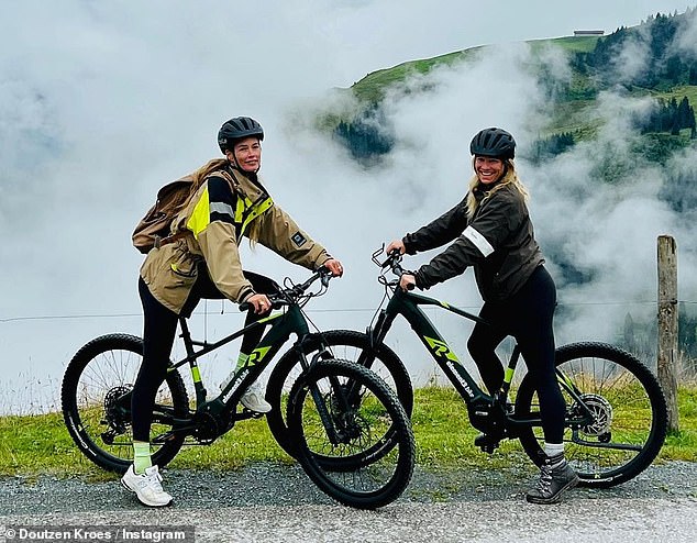 Adventurer: The model (L) hopped on her bike as she explored the picturesque location