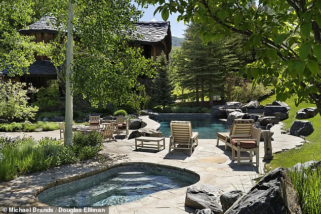 The large patio surrounds the Estate House pool and hot tub