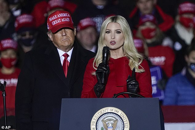 President Donald Trump watches as daughter Ivanka Trump speaks at a campaign event at the Kenosha Regional Airport, November 2, 2020, in Kenosha, Wisconsin