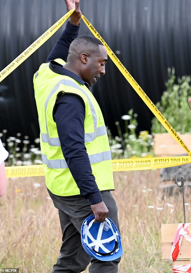 Crime scene: The grisly find leaves Bailey's businessmen in shock as he enters the crime scene