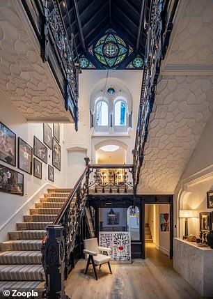 The house has a central staircase in a triple central hall