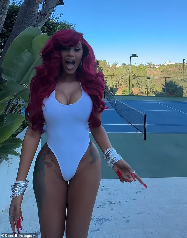 Boss babe: The songwriter's hourglass figure was on full display in her ensemble on the tennis court