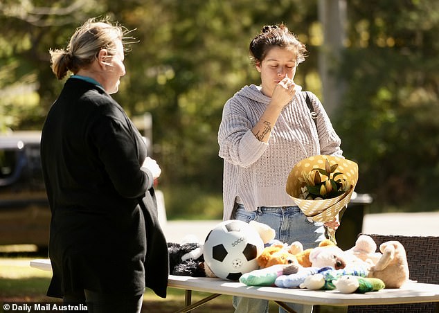 Outraged residents came to lay flowers and pay tribute to the six victims of the fire