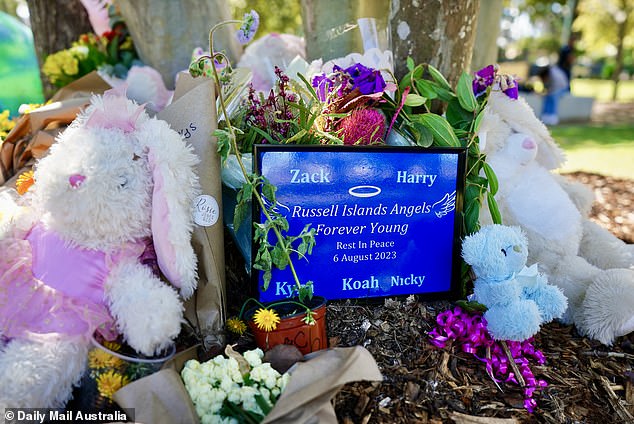 The fatal fire devastated the Russell Island community.  Pictured is a shrine with tributes outside the house