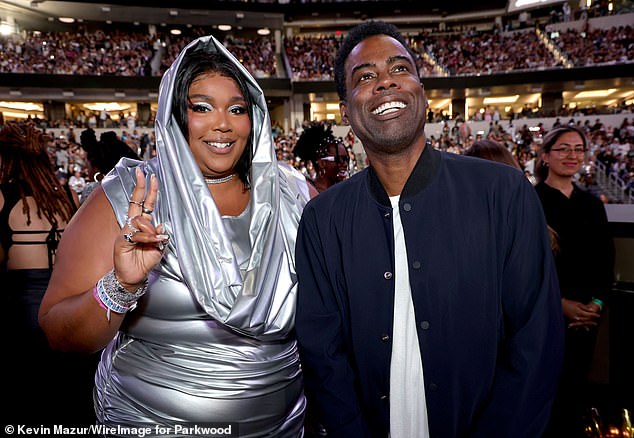 Lizzo and Chris Rock attend the performance last night at SoFi Stadium in Los Angeles