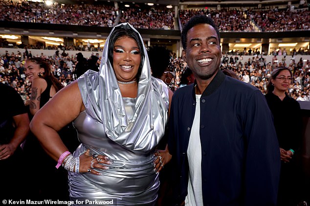 Lizzo and Chris Rock attend the performance last night at SoFi Stadium in Los Angeles