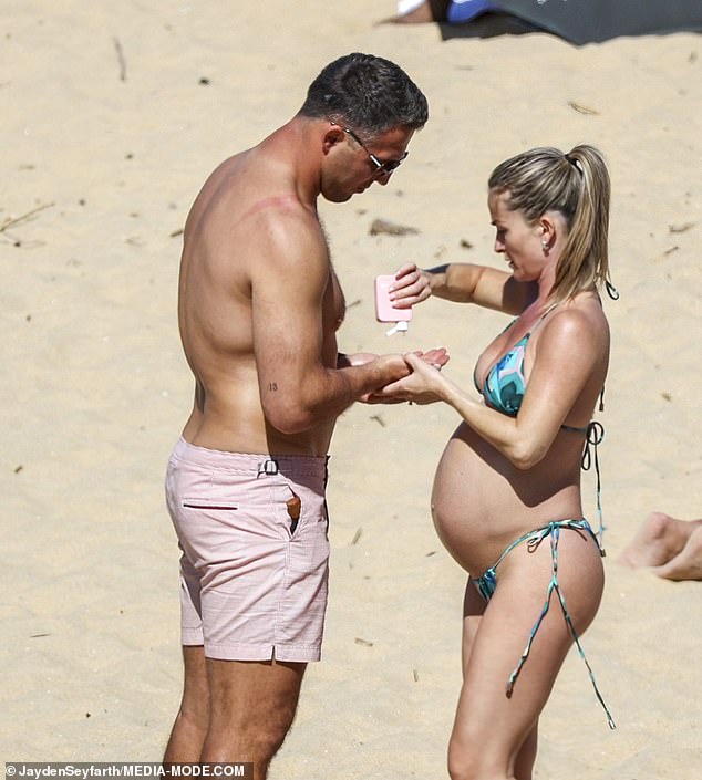 The couple was smart in the sun that day and slathered their bodies with sunscreen