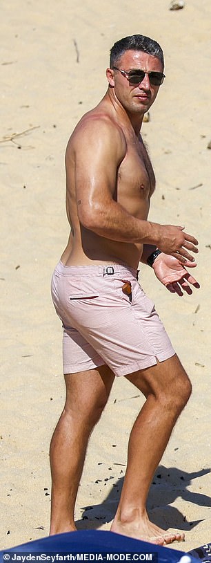 Meanwhile, Sam showed off his toned physique in a pair of pink swimming trunks