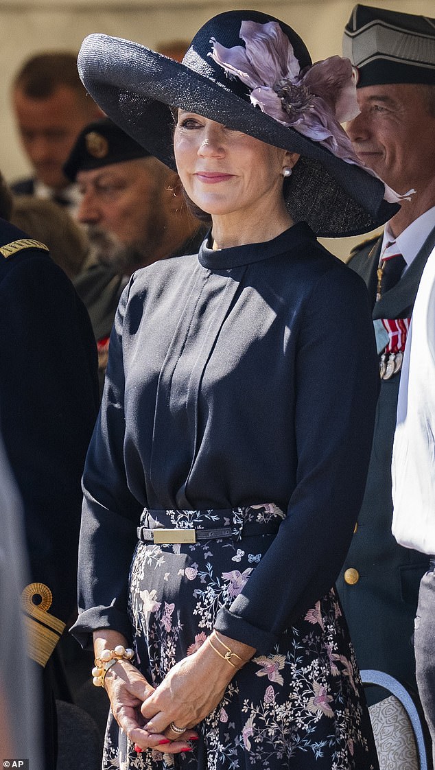 The mother of four, 51, was pictured wiping her eyes while at Kastellet military headquarters, where she and her husband took part in the traditional wreath-laying ceremony for Danish soldiers abroad