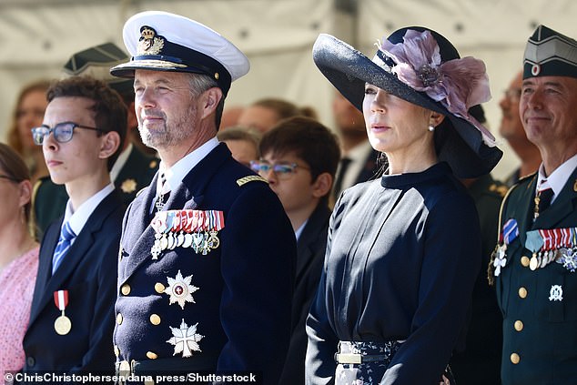 The Australian-born princess was dressed in a pink and blue floral skirt with a navy blue long-sleeved blouse tucked in at the waist