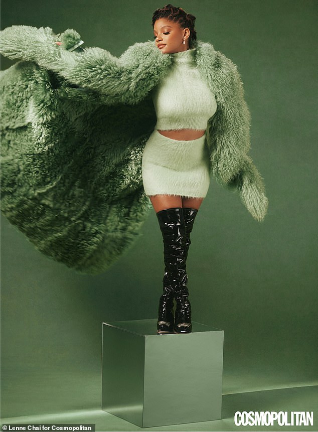 The look: She exuded retro chic in a lime green miniskirt with a matching faux fur lined jacket, while showing off her dizzying legs in a set of black leather thigh-high boots