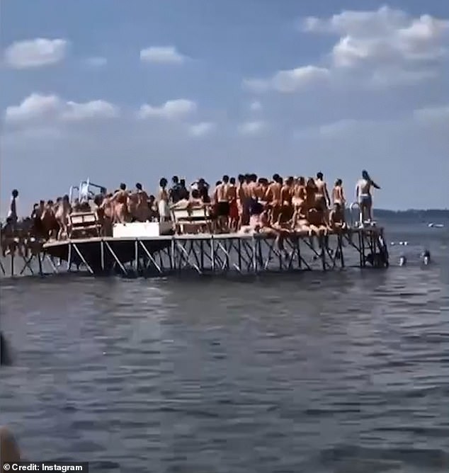 The packed wooden L-shaped deck was full of students in their bathing suits when it gave way, just a day before the pier was due to be demolished for the season