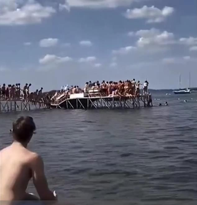 The pier collapsed in a domino formation, with the center collapsing first as the shocked swimmers watched