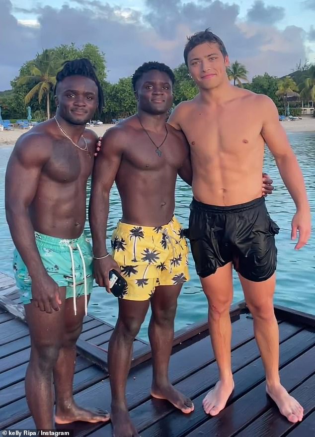 Posing on the pier: Kelly also shared a post of their youngest son, Joaquin, posing with his friends on a pier after they went swimming together