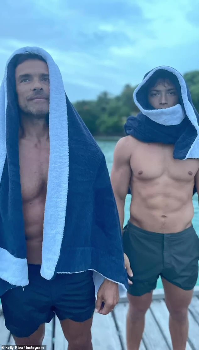 Fun family photo: One picture showed Mark posing next to their son Joaquin, with towels on their heads to dry off their hair after enjoying a swim together