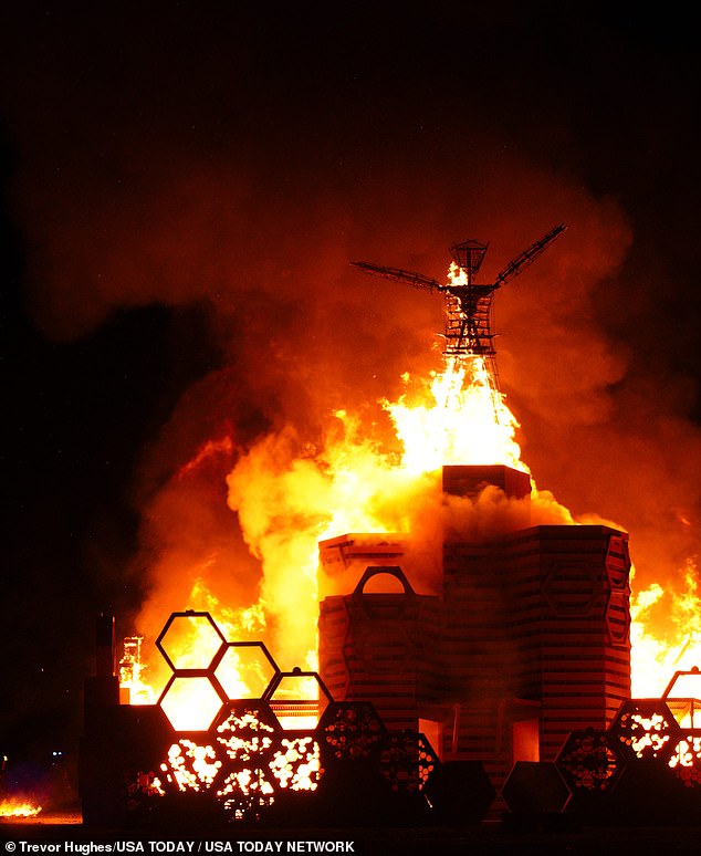 The week-long experimental festival in northwestern Nevada ended Monday, prompting a mass exodus.  (Pictured: The image of the 'man' burning at the festival on Monday)