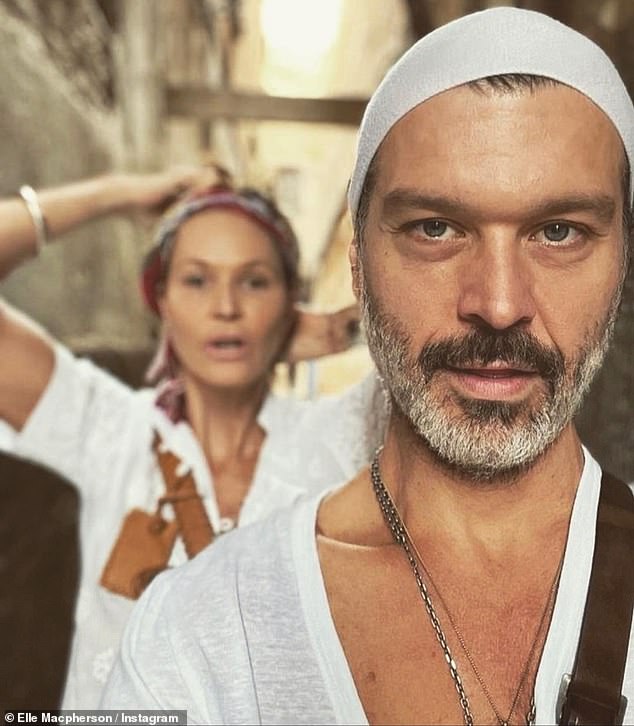 Heading to Europe: A third photo showed the couple wandering the Grotta Sonora, a musical 'cave of sound' full of instruments in the Italian village of Calcata Vecchia