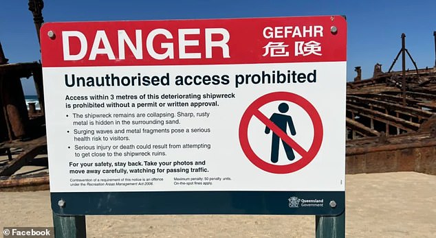 A large 'danger' sign warns visitors that 'unauthorized access' to the shipwreck is 'prohibited', with fines of up to $7,740 for those caught breaking the rules