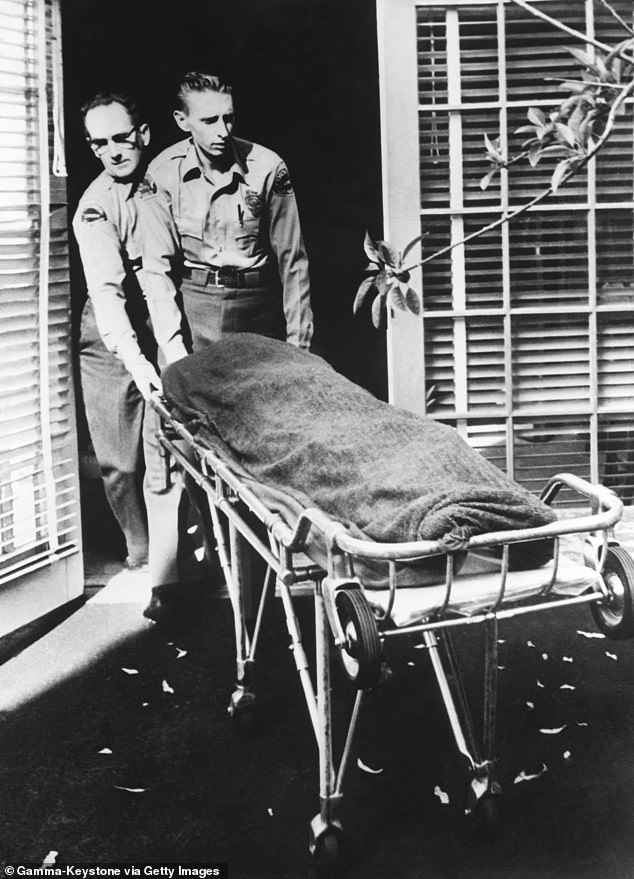 Monroe's body is wheeled out of her home in Brentwood on August 5, 1962