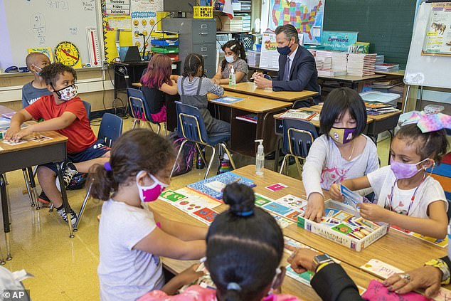 Studies suggest that N95 masks can expose people to toxic chemicals.  Pictured: California Governor Gavin Newsom joins masked schoolchildren in a classroom in August 2021