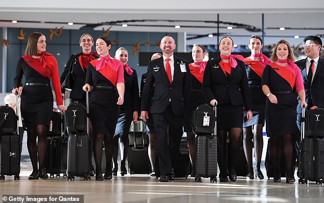 The abrupt departure of Qantas boss Alan Joyce has sparked jubilant celebrations among Qantas staff (stock photo of Qantas crew)