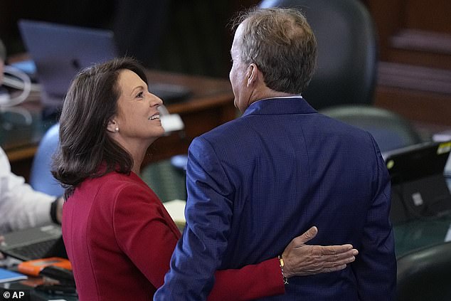 Paxton, right, is hugged by his wife State Senator Angela Paxton, R-McKinney, before the impeachment trial