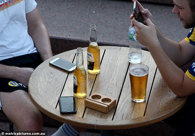 Australian Bureau of Statistics data released this week shows spending on alcoholic beverages and tobacco fell by four per cent in the year to July, based on bank transaction data (pictured is a bar in Sydney)