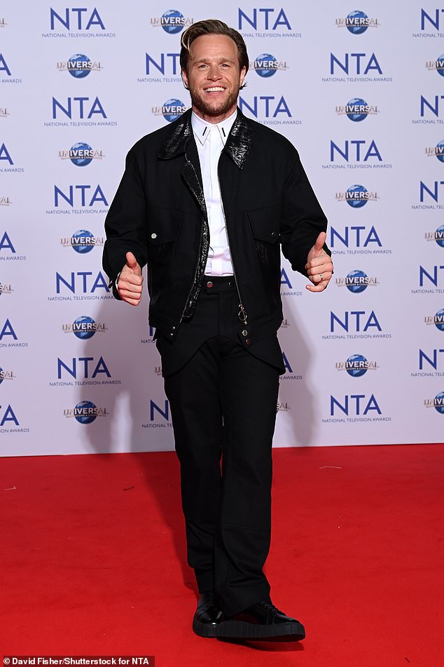 Thumbs up: Olly Murs looks happy to be at the awards ceremony