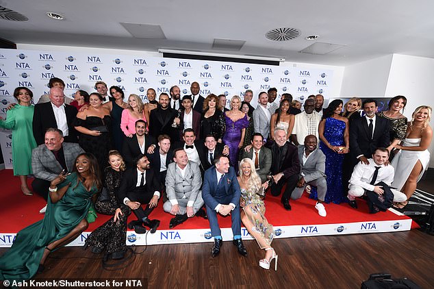 Loved it: The entire cast posed backstage with their award after Tuesday night's show