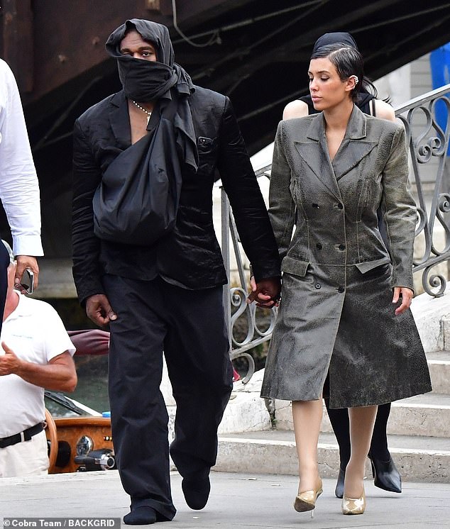 Before boarding the boat, West was covered head-to-toe in an all-black ensemble, while Censori wore a knee-length trench coat that she paired with a pair of nude heels.