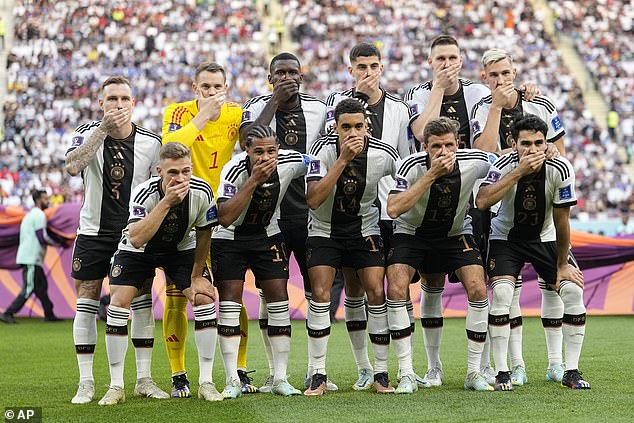 German players covered their mouths before the match to Japan to protest FIFA's decision to ban the 'OneLove' bracelets