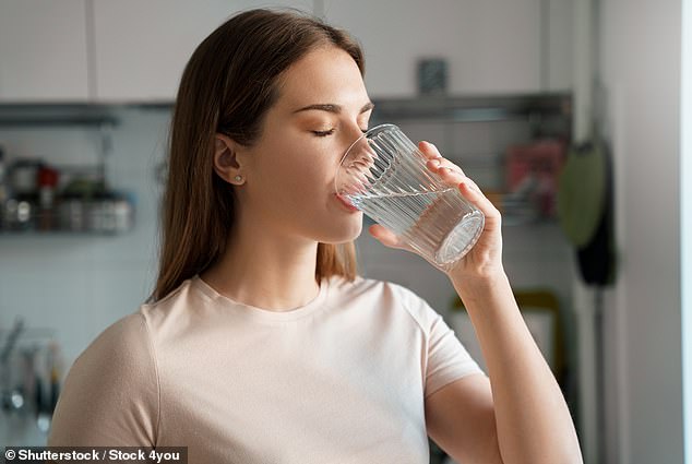 Instead of drinking caffeine and alcohol, people should drink water.  Feeling thirsty, passing dark yellow urine, feeling dizzy and having sunken eyes are all signs of dehydration in children and adults, according to the NHS.