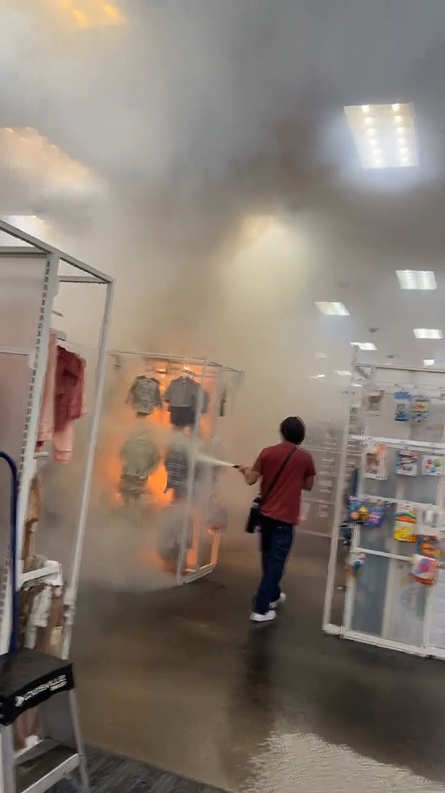 The video also shows an employee frantically trying to use a fire extinguisher to put out the fire