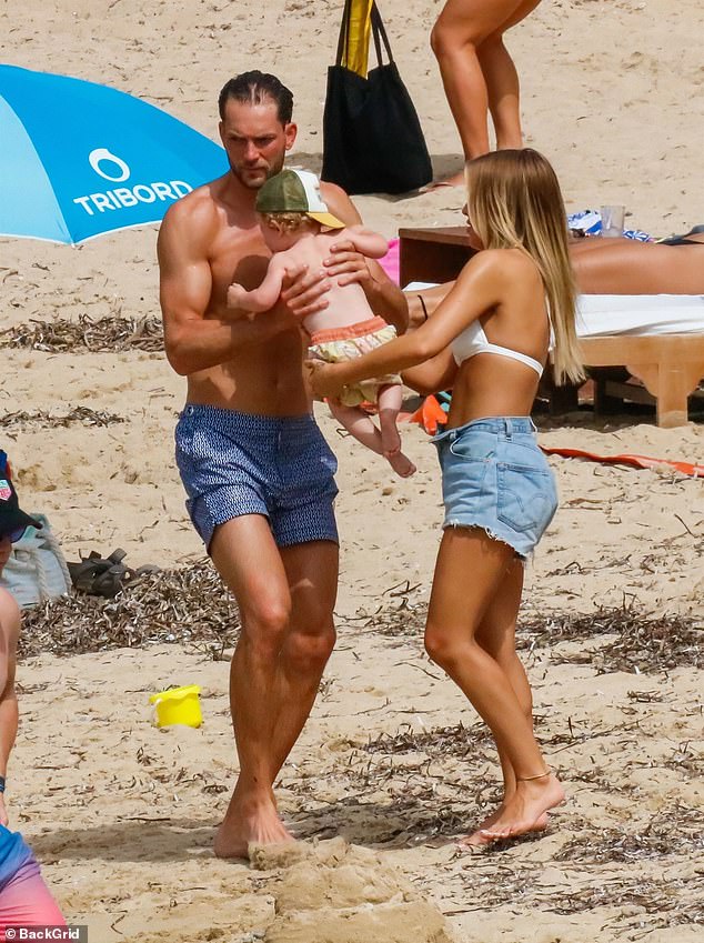 Family: Lottie and Lewis both lovingly spent time with their little one while relaxing on the beach