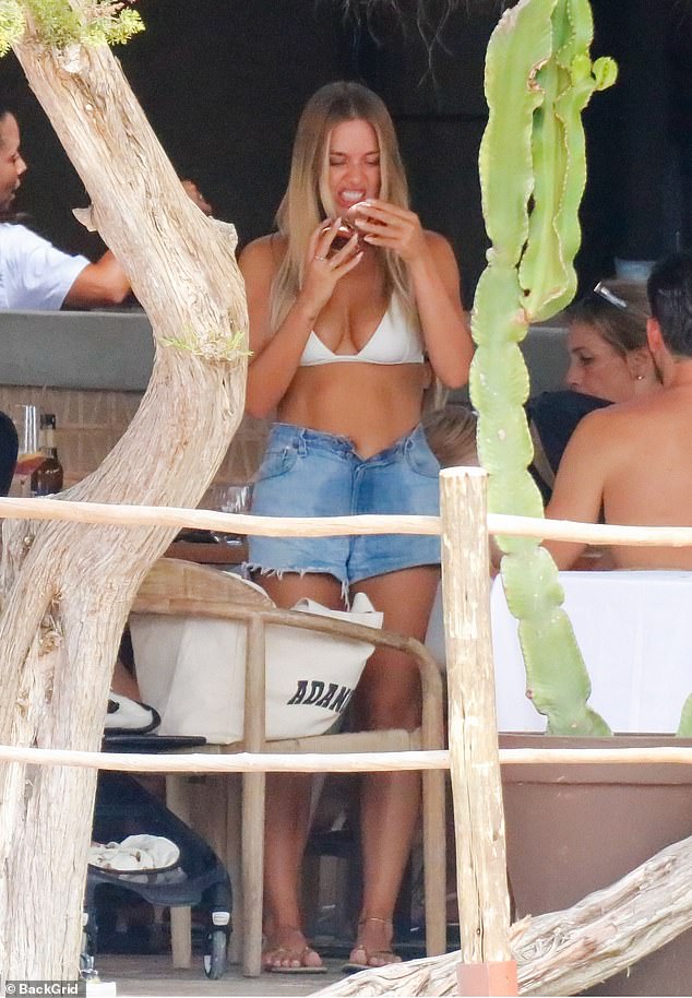 Quick check!  Lottie was seen checking her teeth in a small mirror after having a bite to eat at a restaurant