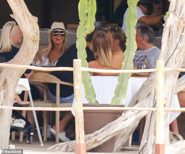 Meal: The family was seen relaxing at a beachfront café as they enjoyed some relaxation