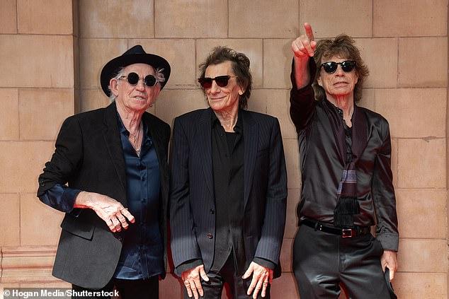 Coming soon: Sir Mick Jagger, Keith Richard and Ronnie Wood, arriving at London's Hackney Empire, revealed to a crowd of screaming fans that the record will fall on October 20.